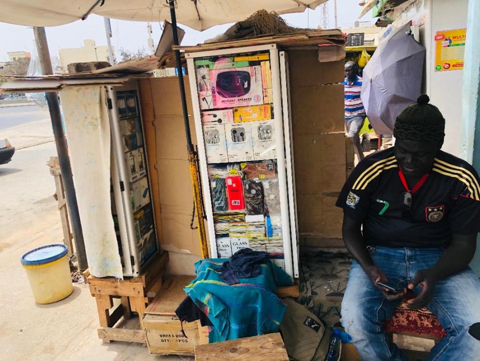 Moussa in his shop, two years after his economic reintegration. Photo: IOM 2022