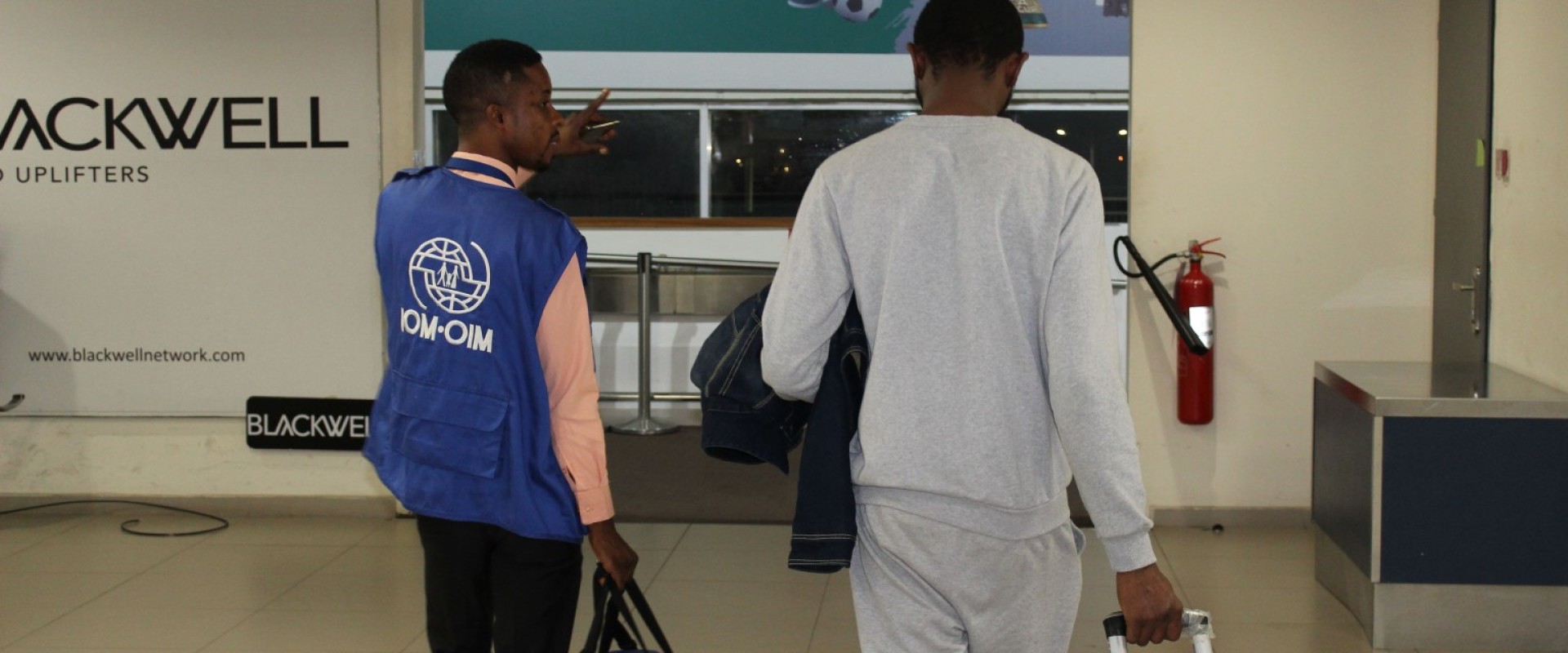 IOM Ghana assists returnees at the Kotoka International Airport in Accra. Photo Credit : IOM/Ghana/Randi-Lyn Miller