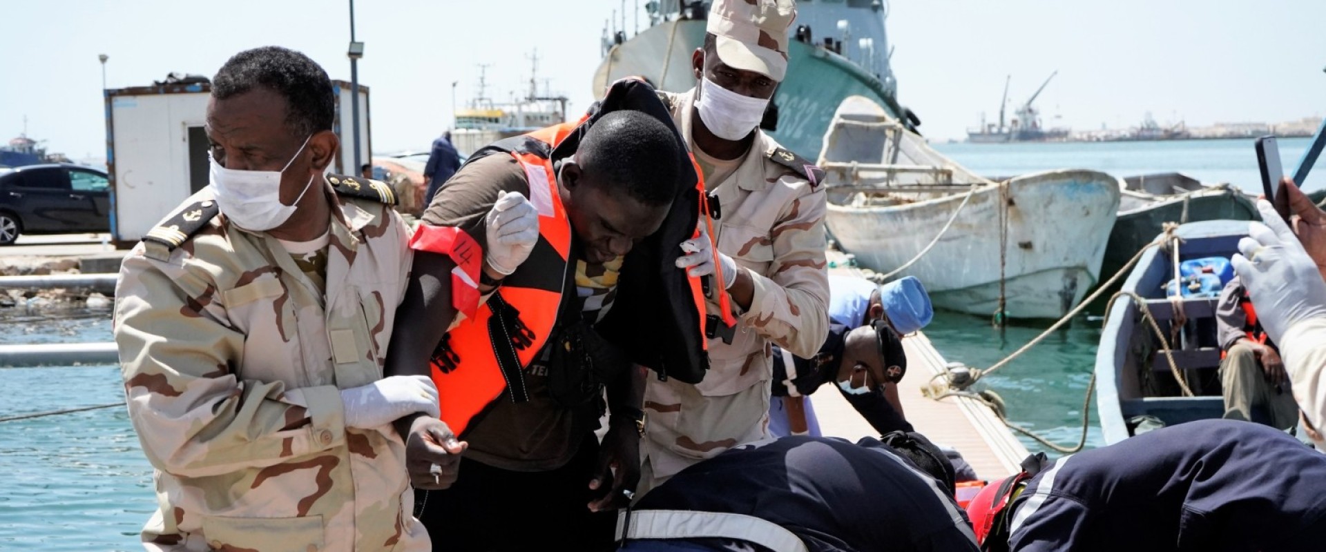 Mauritanian Coast Guard and Civil Protection officers assist migrants intercepted at sea/IOM Mauritania