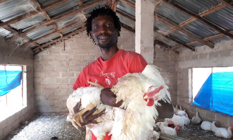 Lamin in his new poultry farm. IOM/Abdoudlie Jammeh